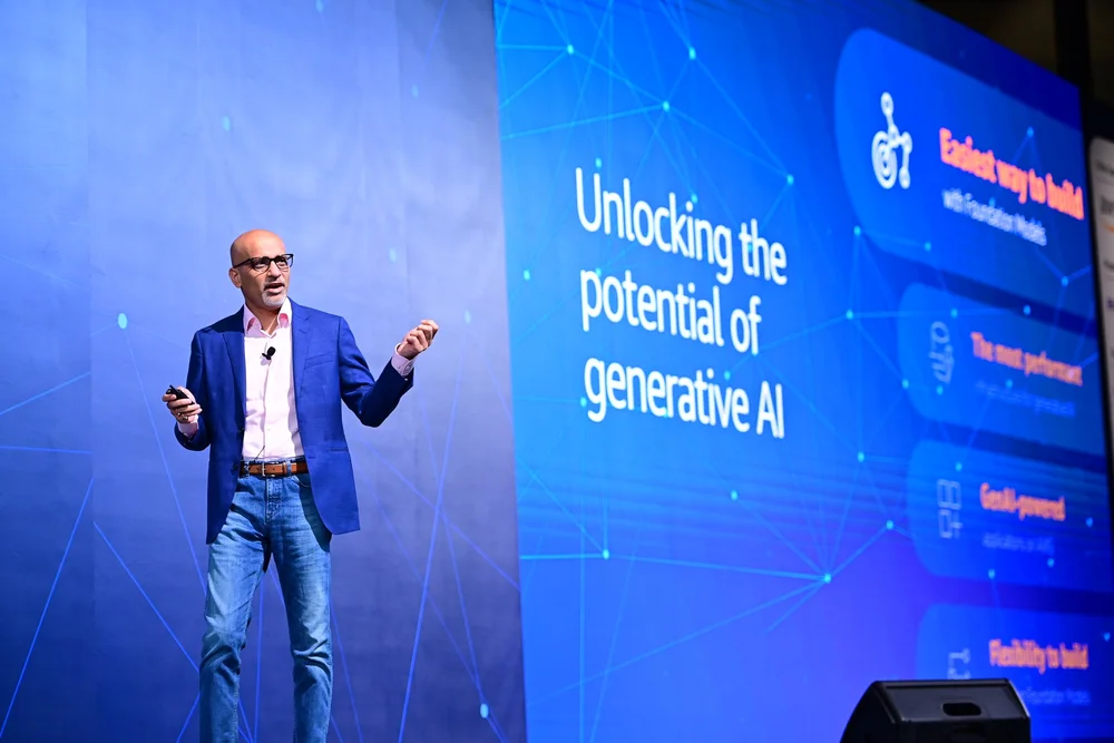 Ritesh on stage at enterprise AI event